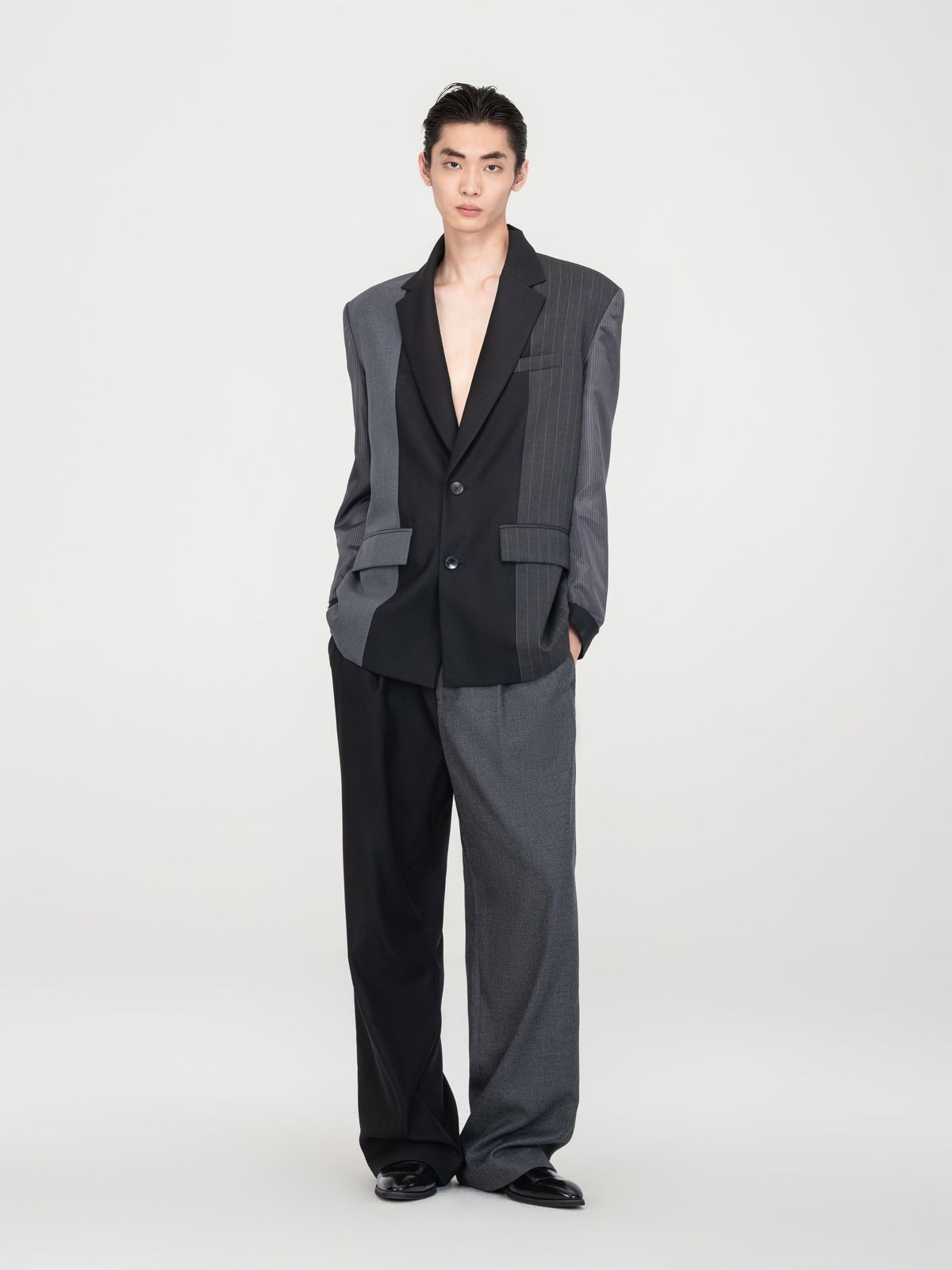 BLACK AND GREY PANELED BLAZER WITH INVERTED STRIPE SLEEVES